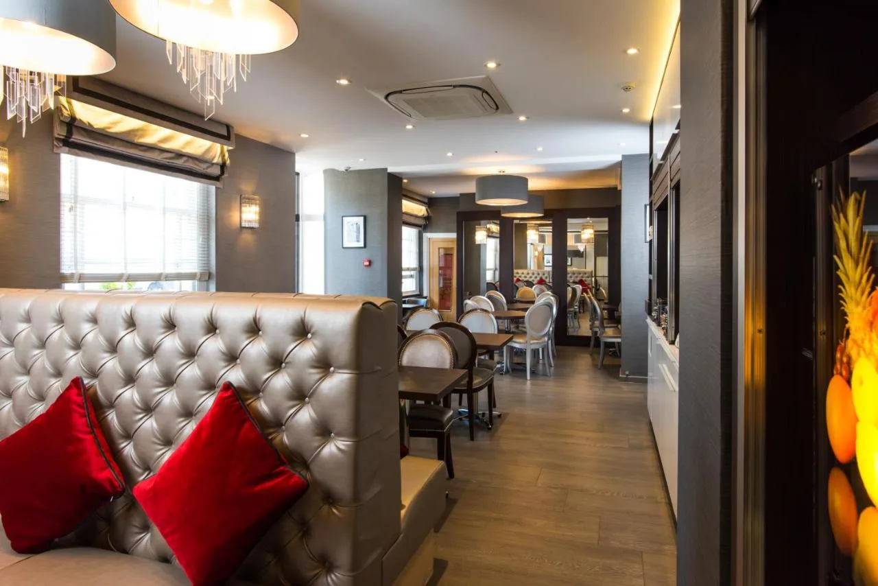 Hotel bar area with red pillows at Best Western Buckingham Palace Rd, Westminster
