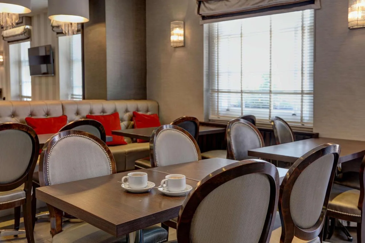 Dining room with tables and windows overlooking the street